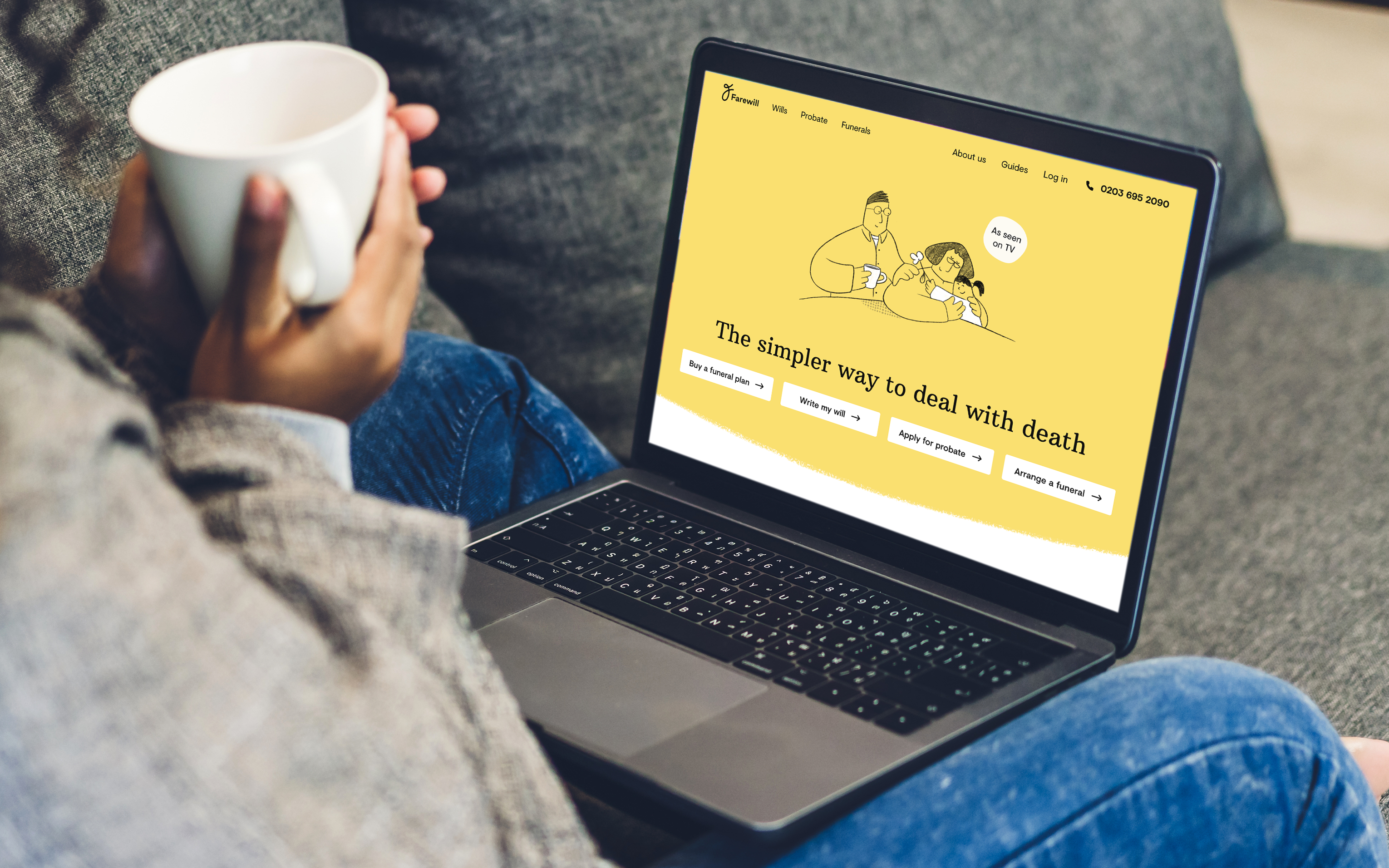 A person holding a mug beside a laptop showing a yellow website page about death.